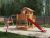 Fungoo Spielturm Mars teakfarben inkl. Rutsche rot – BxTxH: 558x301x280 cm, inkl. Doppelschaukel + Kletterwand, inkl. Picknick-Tisch + Rutsche rot